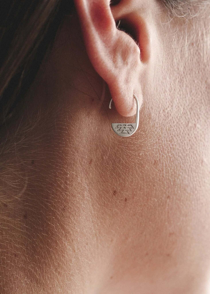 Aztec Earrings — silver earring on model, geometric pattern detail — MYFASHIONFRUIT