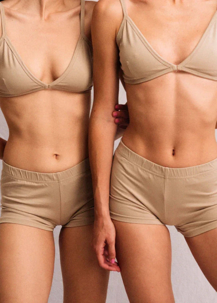 Two women wearing the Fierce Bralette and matching shorts in sand — MYFASHIONFRUIT