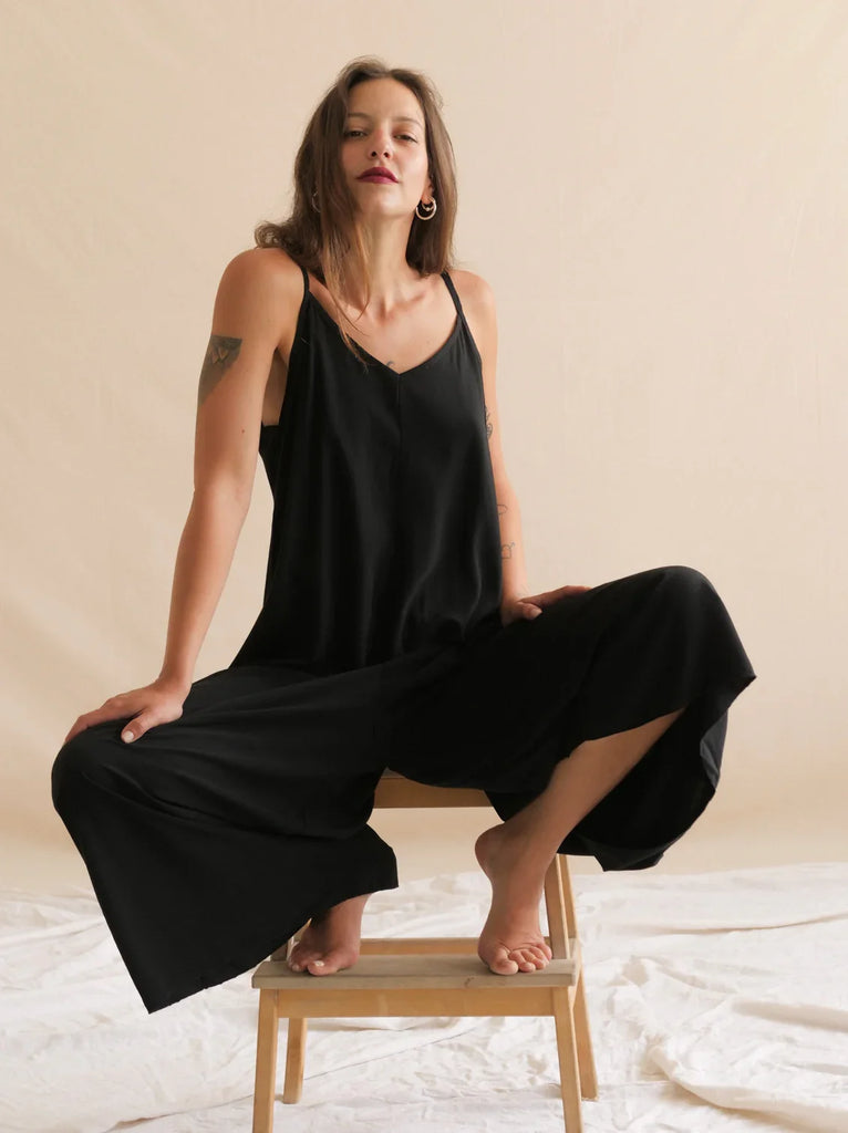 Catalina Noir Jumpsuit — Black jumpsuit with wide legs on model — MYFASHIONFRUIT