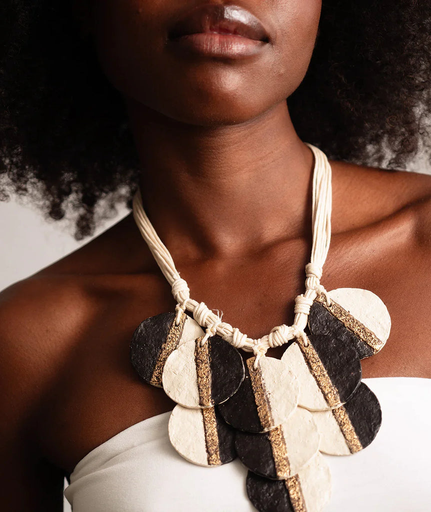 Woman wearing a Ceres Necklace, large paper mache circles with gold stripe detail — MYFASHIONFRUIT