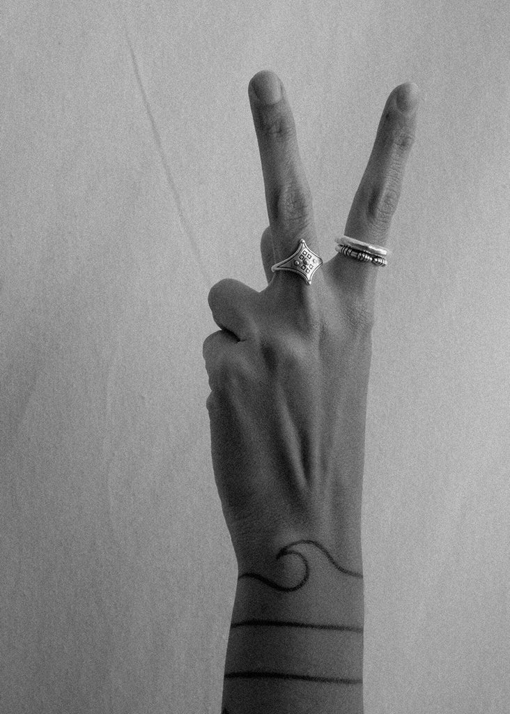 Cylindrical Ring — Hand with rings, peace sign detail — MYFASHIONFRUIT
