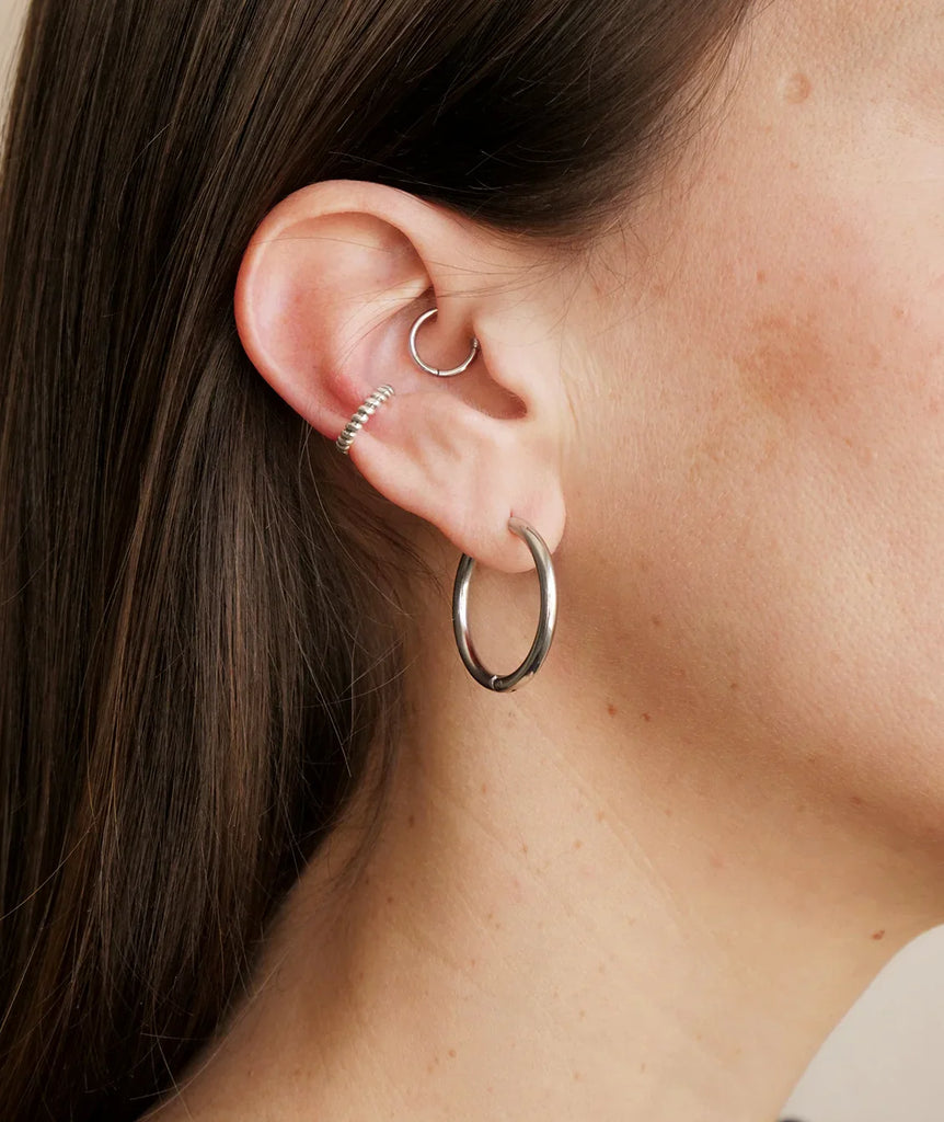 Bekke Ear Cuffs — Silver earrings on ear — MYFASHIONFRUIT