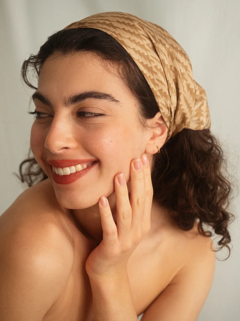 Woman wearing a beige printed silk scarf as a head covering — MYFASHIONFRUIT