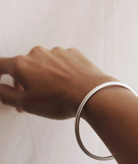 Kay Bracelet — Silver cuff on tan skin — MYFASHIONFRUIT