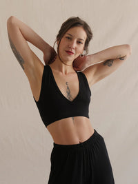 Woman wearing a soft black bralette with V neck and matching trousers — MYFASHIONFRUIT