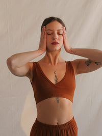 Woman wearing a caramel Soft Bralette with V neck and elastic band — MYFASHIONFRUIT