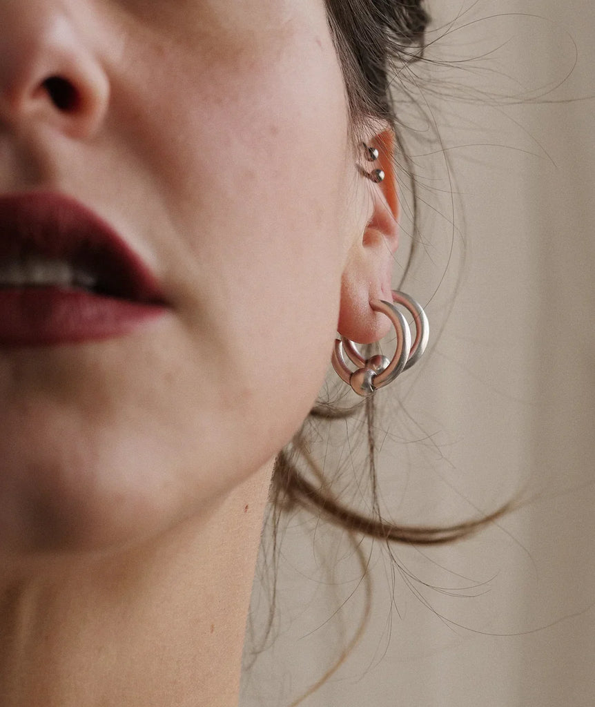Peg Hoops — Silver earring on ear — MYFASHIONFRUIT
