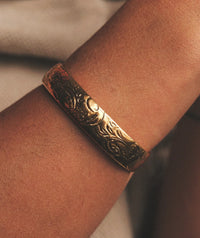 Treasure Cuff detail — gold carved bangle on a wrist — MYFASHIONFRUIT