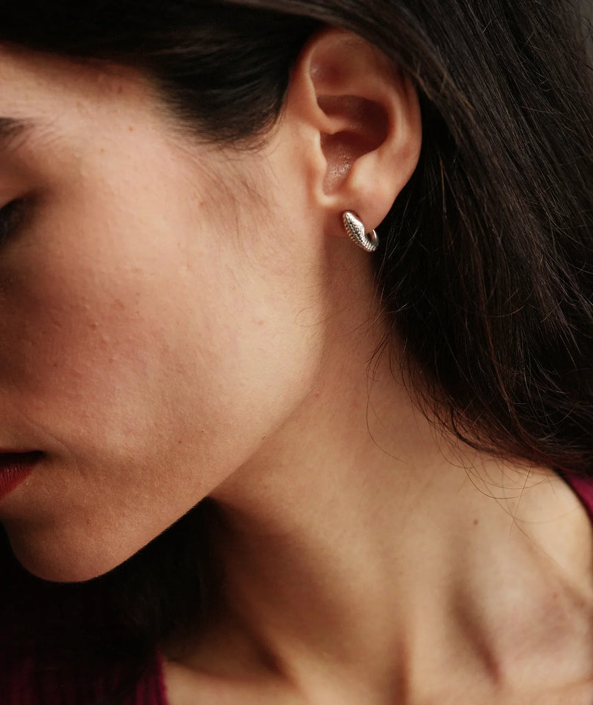 Naga Earrings — silver tone textured hoop on model — MYFASHIONFRUIT