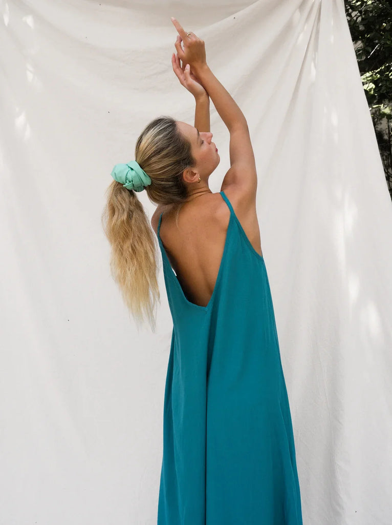 Granadas Dress — Teal maxi dress with a low back on model — MYFASHIONFRUIT