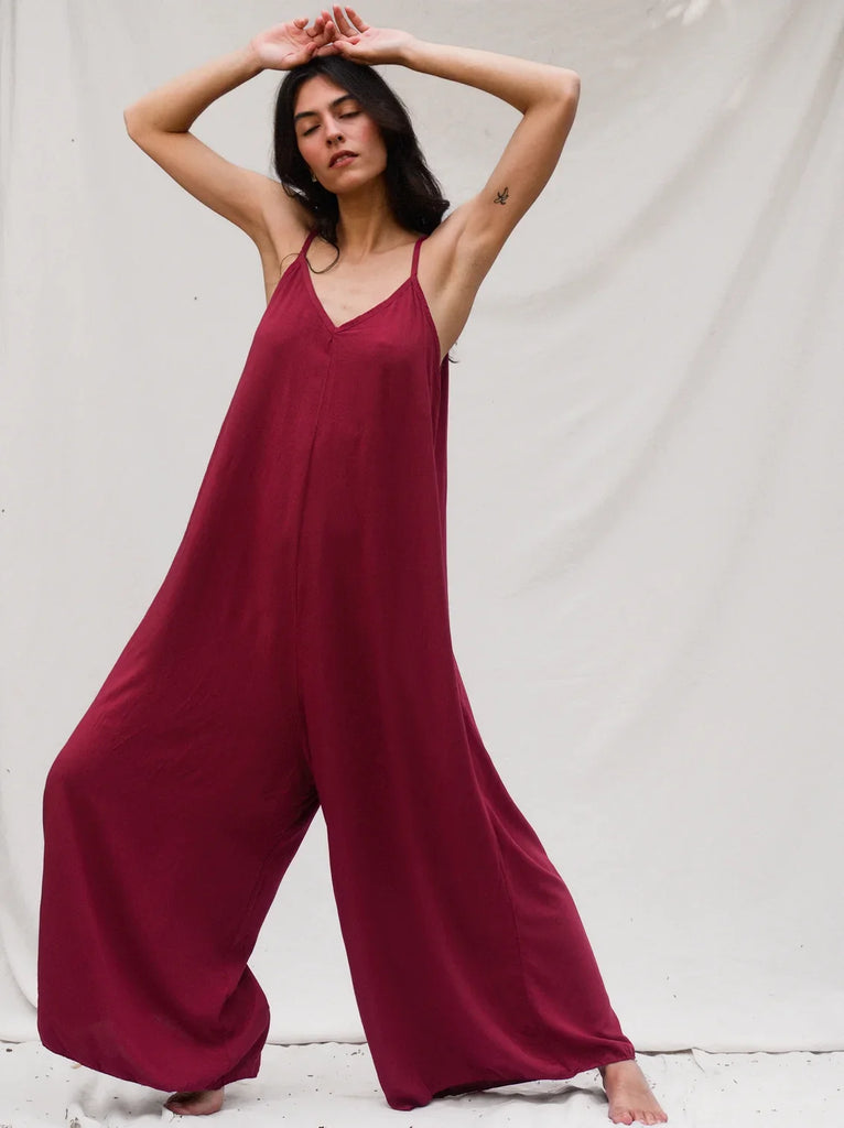 Catalina Cerise Jumpsuit — Burgundy jumpsuit with thin straps on model — MYFASHIONFRUIT