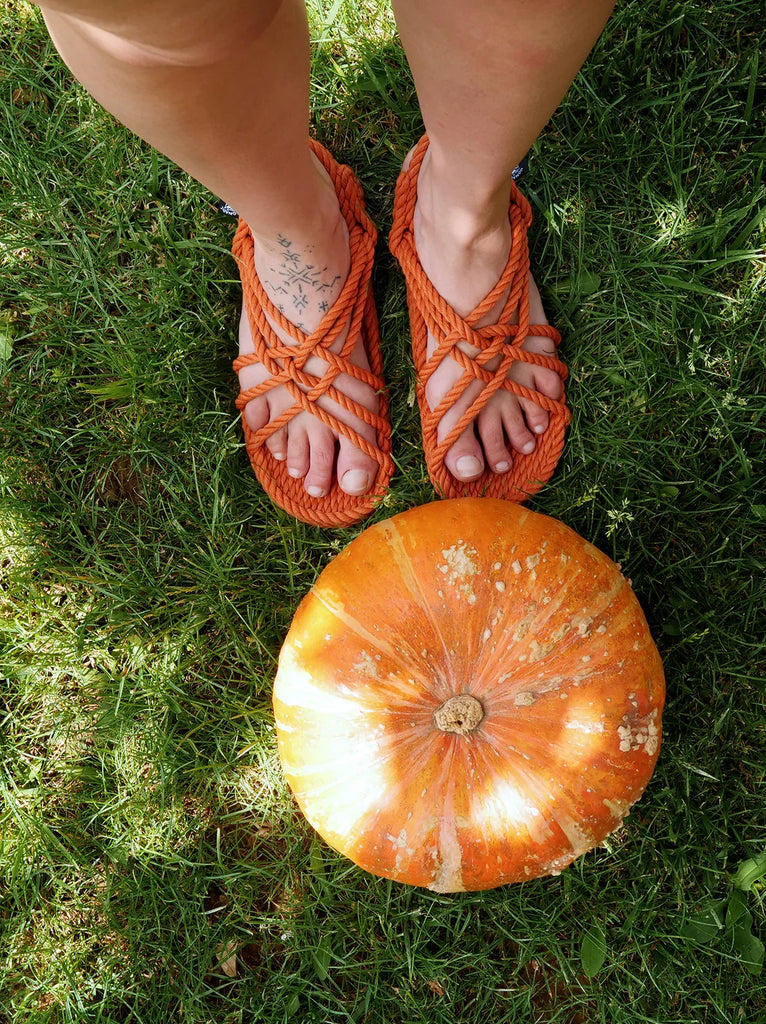 Woman wearing JC Pumpkin Sandals with rope straps, pumpkin on grass — MYFASHIONFRUIT